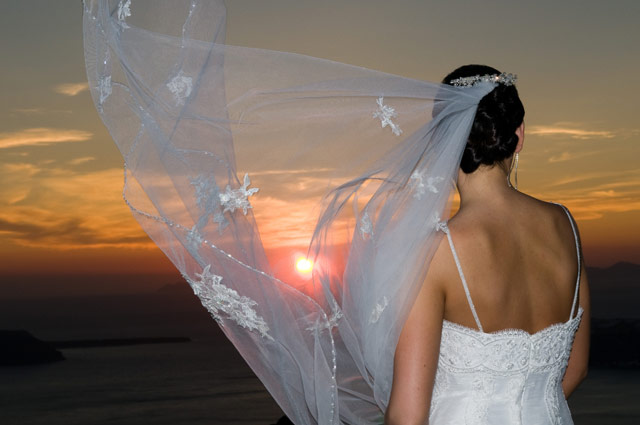 bride and santorini caldera sunset