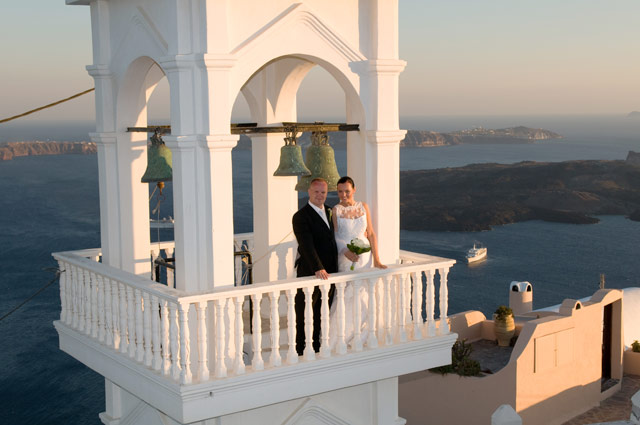 married couple on imerovigli bell tower